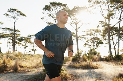 Buy stock photo Fitness, running and man on road in forest for health, wellness and strong body development. Workout, exercise and runner on path in nature for marathon training, performance and morning challenge.