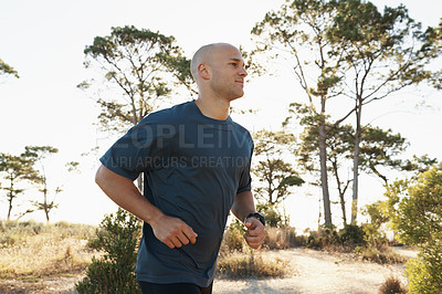 Buy stock photo Fitness, running and man on path in forest for health, wellness and strong body development. Workout, exercise and runner on road in nature for marathon training, performance and morning challenge.