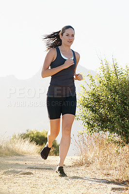 Buy stock photo Runner, woman and running on trail with fitness for sport, training or exercise for competition on mountain. Athlete, person or marathon with wellness, challenge or cardio for healthy body in Denmark