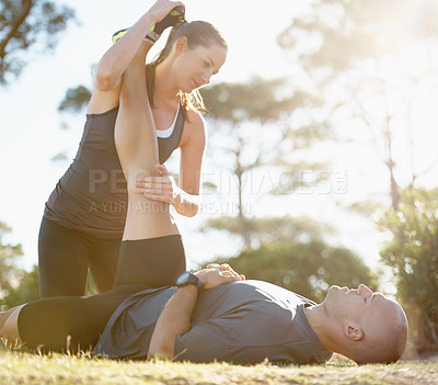 Buy stock photo Nature, stretching and man with personal trainer for help, workout coach and fitness for healthy body. Exercise, wellness and athlete with woman in muscle warm up for outdoor training in morning.