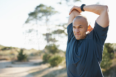 Buy stock photo Nature, stretching and man in forest for fitness, workout and commitment to healthy body. Exercise, wellness and athlete in arm muscle warm up for outdoor training, performance and morning in woods.