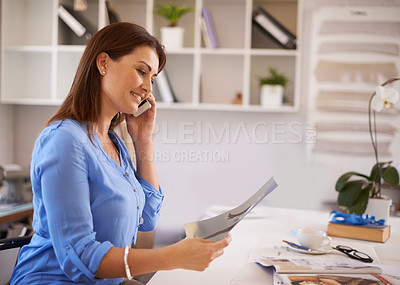 Buy stock photo Business woman, magazine and phone call for planning, communication and networking in public relations job. Young worker, employee or designer talking on her mobile with print, photograph and catalog