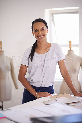 Buy stock photo Fashion, woman and portrait of tailor with drawing on paper for planning in workshop with mannequin. Creative, designer or smile with sketch on table and happiness for unique style in boutique studio