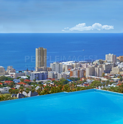 Buy stock photo Swimming pool, city and building or ocean outdoor at travel destination in summer for hotel, infrastructure or downtown. Skyline, water and lodge accommodation in Cape Town or relax, trip or vacation