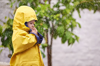 Buy stock photo Child, jacket and rain in outdoor for fashion, play and walk to kindergarten in cold. Boy, cute and adorable kid with clothes in water droplets in garden or backyard for childhood and innocent  