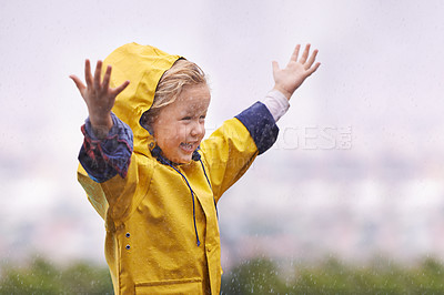 Buy stock photo Winter, raincoat and a girl having fun in the water outdoor alone, playing during the cold season. Kids, rain or wet with an adorable little female child standing arms outstretched outside in the day