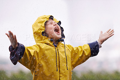 Buy stock photo Girl, playing outdoor and screaming in rain, nature and excited with winter fashion. Female child, raincoat and playful with water, open hands and happiness on adventure with freedom in childhood