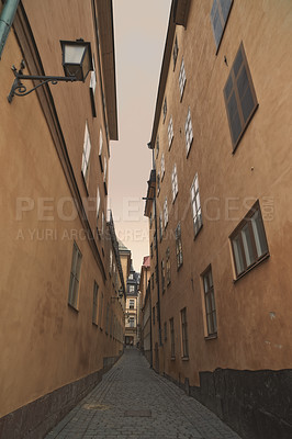 Buy stock photo Travel, architecture and alley of vintage buildings in old town with history, culture and calm holiday destination. Vacation, landmark and quiet street in Sweden with retro apartment in ancient city.