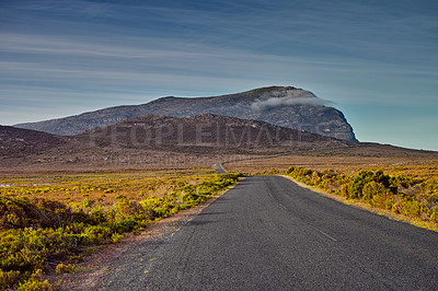 Buy stock photo Mountains, road trip and green landscape with travel, holiday and natural countryside in South Africa. Nature, environment and highway for journey, vacation and outdoor adventure with clouds in sky.