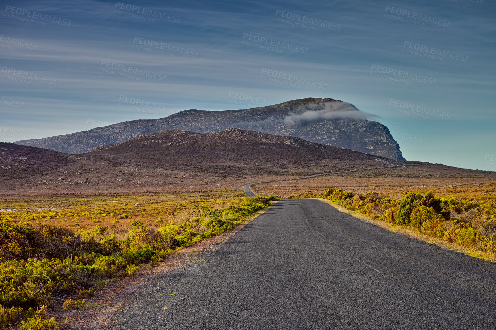 Buy stock photo Mountains, road trip and green landscape with travel, holiday and natural countryside in South Africa. Nature, environment and highway for journey, vacation and outdoor adventure with clouds in sky.