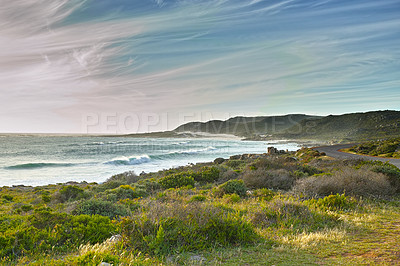 Buy stock photo A rocky coastline in the Western Cape, South Africa on a hot summer day. Sky and beach, a perfect getaway filled with self care resorts and wellness outdoor activities with tropical weather