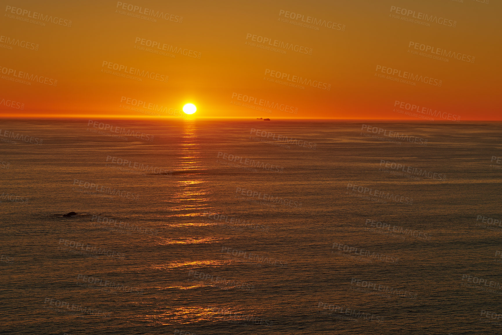 Buy stock photo Shot of a beautiful sunset over the beach