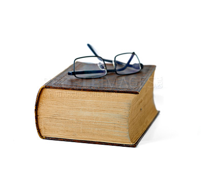 Buy stock photo Old, book and glasses with ancient manuscript for knowledge, literature or history on a white studio background. Closeup of historic novel or spectacles for vintage scripture or reading on mockup