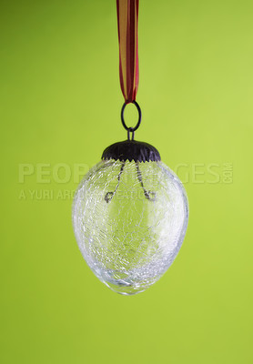 Buy stock photo Closeup of a glass lightbulb against a green copyspace background. Zoom in on lightbulb details with no electricity to power, energy crisis, turned off for load shedding, power outage or blackout