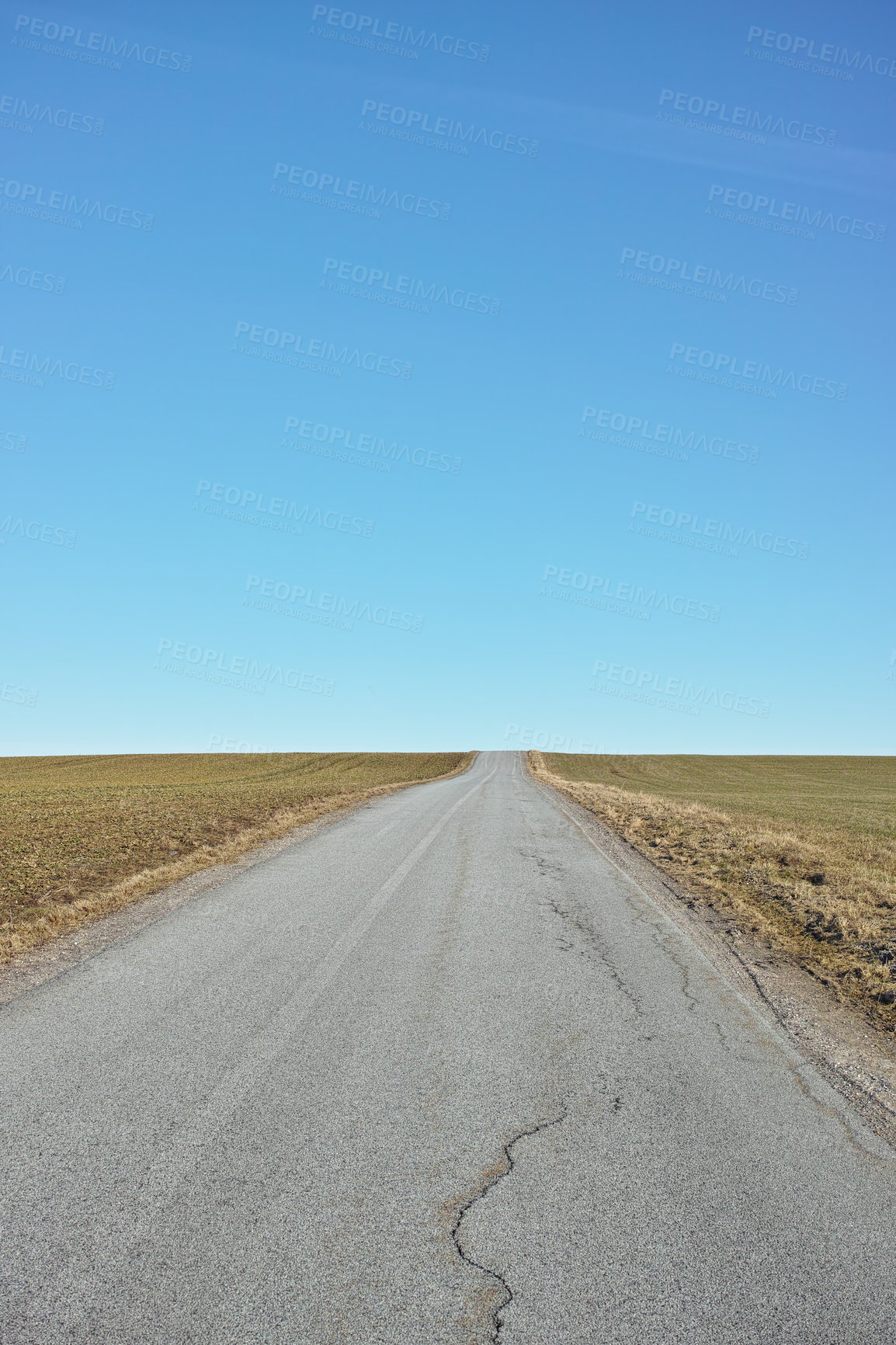 Buy stock photo Blue sky, road trip and desert landscape for travel, holiday and natural scenery in countryside. Nature, horizon and street for journey, vacation or outdoor adventure with peace, relax and wilderness