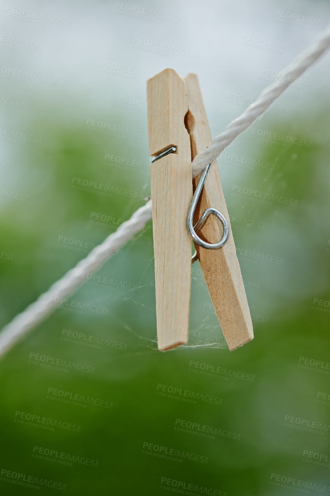 Buy stock photo Peg, rope and outdoor for clothes from laundry, clean and dry in nature with plastic clip of closeup. Washing, empty line and wooden tool to hang or pin cloth on wire, fasten and backyard AT house