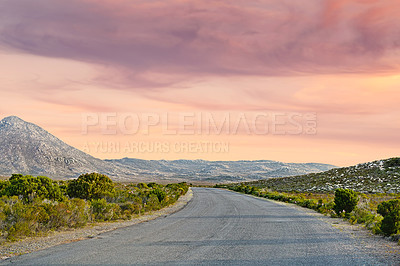 Buy stock photo Sunset sky, road trip and red landscape with mountain, travel holiday and green countryside. Nature, environment and empty highway for journey, vacation and outdoor adventure with hill on horizon.