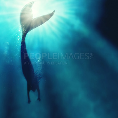 Buy stock photo A silhouette shot of a mermaid swimming in solitude in the deep blue sea - ALL design on this image is created from scratch by Yuri Arcurs' team of professionals for this particular photo shoot