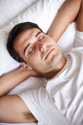 Buy stock photo Man, sleep and bed for peace, wellness and rest for indoor in pajamas and bedroom for home and happy. Male person, relax and dreaming at house, calm and tired and eyes closed in top view nap