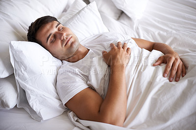 Buy stock photo Male person, sleep and bed for peace, wellness and happy for rest in white top and bedroom for home and happy. Man, relax and dreaming at house, calm and tired after day at work and taking nap 
