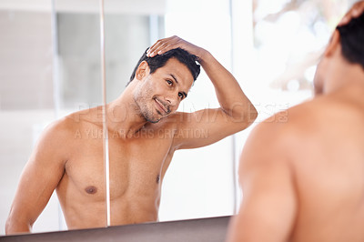 Buy stock photo Bathroom, mirror and happy man with hair check, in a house for skincare, wellness or morning routine. Hairline, reflection and male person with growth, texture or satisfaction after shower at home