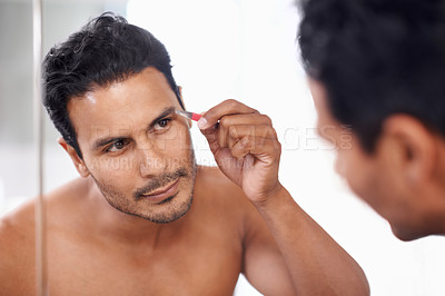 Buy stock photo Eyebrow, hair removal and tweezers of man for maintenance, grooming and self care in bathroom mirror. Cosmetology, skincare and male person for facial treatment, brows shape and morning routine.