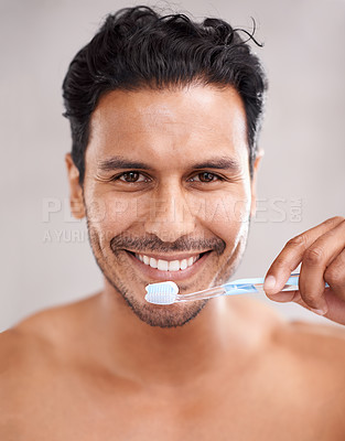 Buy stock photo Dental, portrait and man in bathroom for brushing teeth, self care and morning routine. Oral hygiene, smile and face of Mexican male person at home for wellness, toothbrush and healthy mouth.