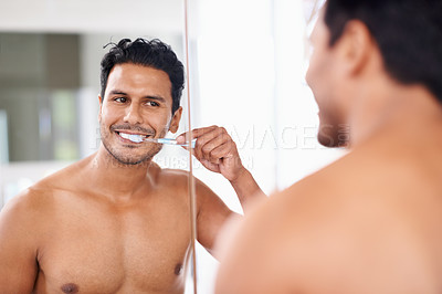 Buy stock photo Oral hygiene, mirror and man in bathroom for brushing teeth, self care and morning routine. Dental, smile and face of male person at home for wellness, toothbrush and cleaning with reflection.