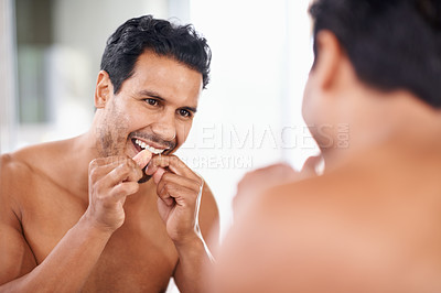Buy stock photo Dental health, mirror and man in bathroom for teeth cleaning, self care and morning routine. Oral hygiene, tooth and face of male person at home for wellness, flossing and gums with reflection.
