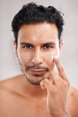 Buy stock photo Skincare, portrait and cream with man in bathroom for morning routine, facial treatment and cosmetics. Self care, confidence and face of male person for sunscreen, lotion or collagen moisturizer.