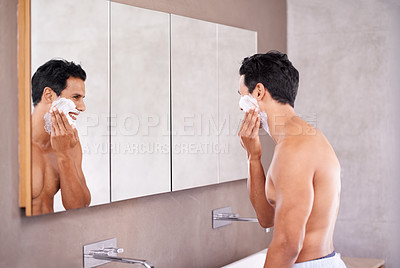Buy stock photo Skincare, mirror and man with foam on face in bathroom for shaving, grooming and hair removal. Smile, cosmetics and male person for wellness, facial treatment or morning routine by reflection.