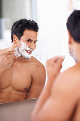 Buy stock photo Hair removal, man and shaving foam on face in bathroom mirror for grooming, morning routine and razor. Smile, skincare and male person for wellness, facial treatment or cosmetics with reflection.