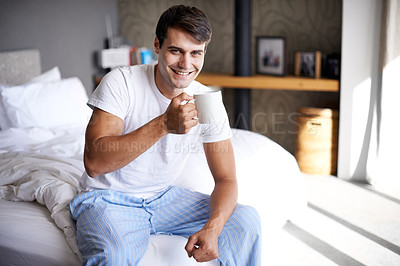 Buy stock photo Man, bedroom and morning coffee portrait and smile, weekend off in apartment to relax with attractive male person. Casual and holiday or home, Saturday off day and comfortable positive guy with cup
