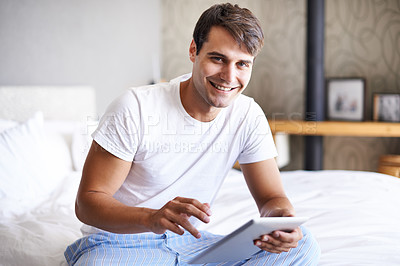 Buy stock photo Man, tablet and pajamas for morning, routine and book in bedroom for wellness and digital for class. Male person, hobby and student for relaxation, leisure and reading for home free time in house