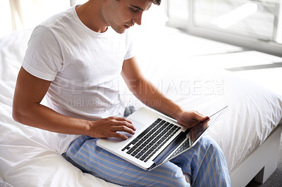 Buy stock photo Man, happy and laptop in bedroom, scroll and entertainment in pajamas and morning routine. Male person, browse and social media with technology, bed and smile in sleepwear at home for relaxation