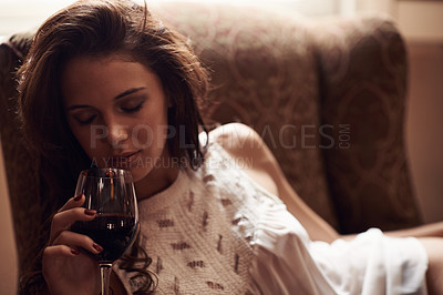 Buy stock photo Woman, couch and wine to relax at home, alcohol and natural ambient light with eyes closed. Smelling, aroma with liquid in glass, comfortable at house after meal in free time on weekend holiday
