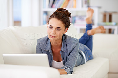 Buy stock photo Shot of an attractive woman using her laptop at home