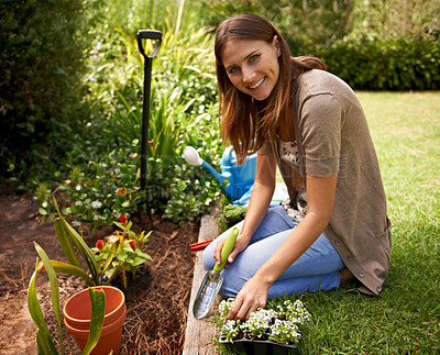 Buy stock photo Woman, portrait and gardening for agriculture in backyard with garden shovel, happiness and sustainability. Gardener, person and green fingers with plants and flower for growth or eco friendly hobby 