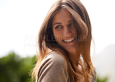 Buy stock photo Shot of a woman enjoying the sunshine outdoors