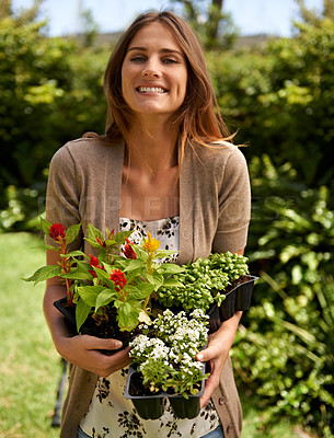 Buy stock photo Woman, smile and flowers for gardening and plant in environment outdoor with sunshine. Gardener and happy person with shrub and bloom for sustainability, growth and earth for lawn or park
