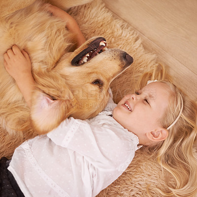 Buy stock photo Dog, girl and hug together on floor in living room and golden retriever, kid and playing with pet on lounge carpet. Young child, labrador and happiness or family home, pets and children from above