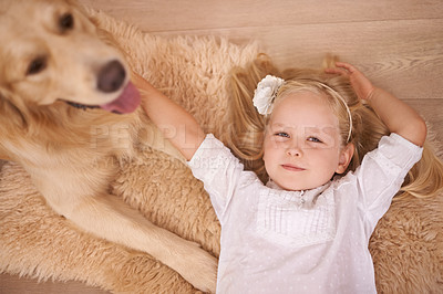 Buy stock photo Girl, dog and relax in portrait for bonding, care and pet for support on floor of living room in home. Child, golden retriever and stroke a puppy in apartment, top view and companion in childhood