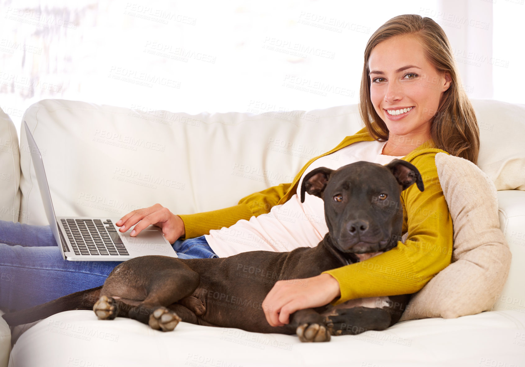 Buy stock photo Portrait, woman and laptop by dog on couch, sofa and relax at home with technology, internet and connection for online blog. Female person, pet and smile in living room, house and apartment