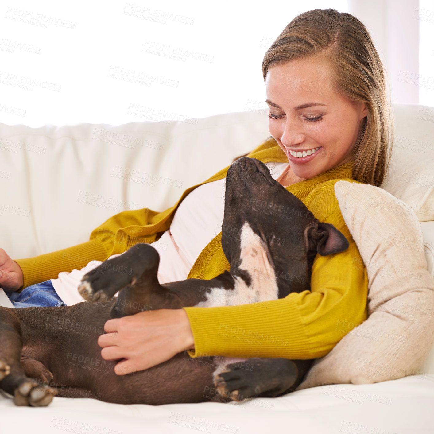 Buy stock photo Love, woman and dog on couch, sofa and relax in house, home and living room with affection for pet. Female person, domestic animal and smile in apartment, lounge and bonding in Paris living room