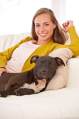 Buy stock photo Woman, dog and relax in living room in portrait, smile for pet love and bonding at home with domestic canine. Happy, positive and trust with foster or adoption, pitbull puppy and animal care on couch