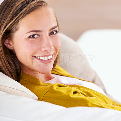 Buy stock photo Closeup, portrait and woman in house, home and apartment to relax on sofa, couch and smile for happiness. Female person, confidence and gen z girl in lounge, living room and residence for time off