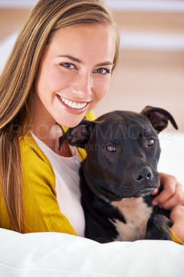 Buy stock photo Woman, dog and happy in living room in portrait, smile for pet love and bonding at home with domestic canine. Relax, positive and trust with foster or adoption, pitbull puppy and animal care on couch