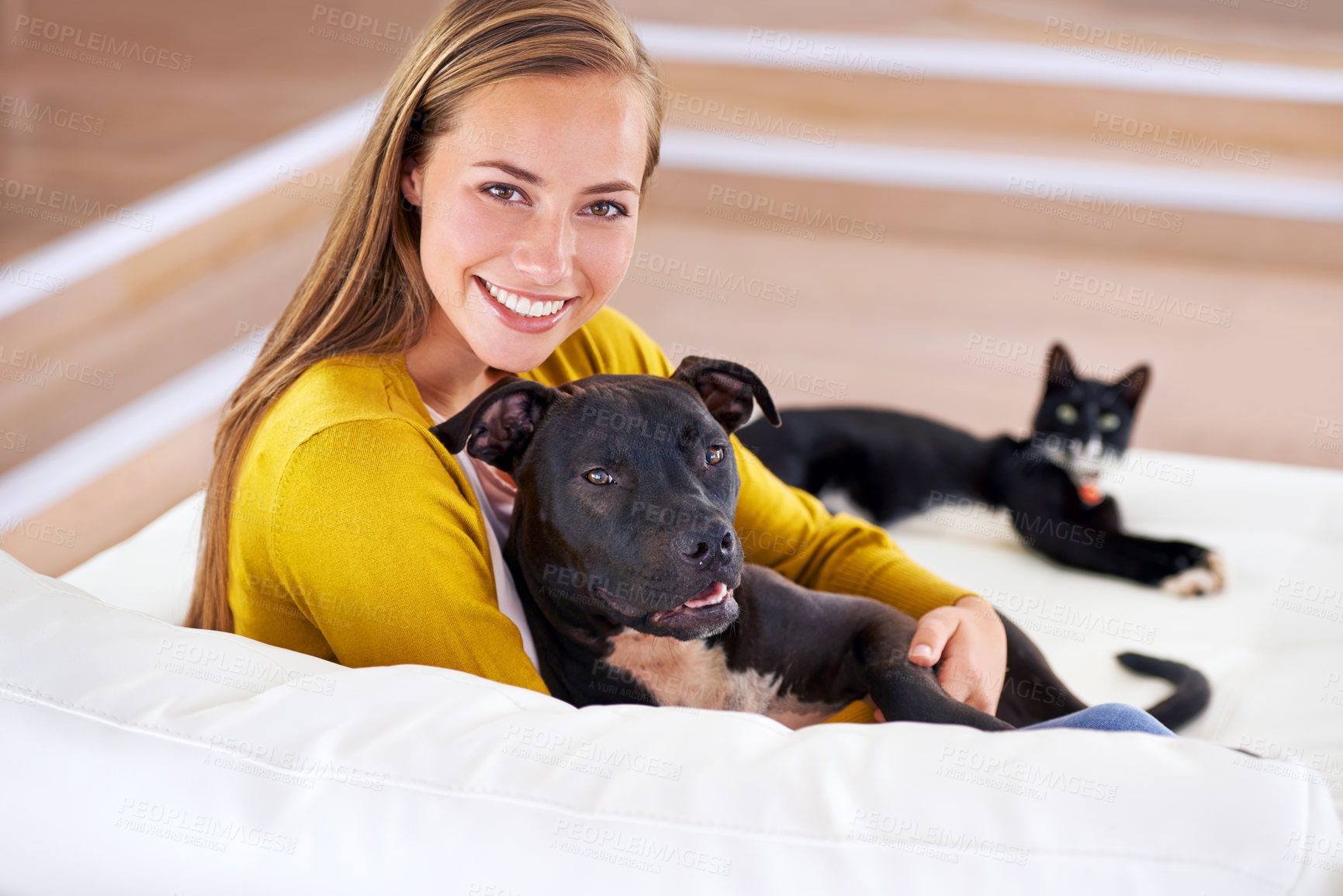 Buy stock photo Woman, pets and relax on sofa in portrait, smile for dog and cat love with bonding at home. Happy, positive and trust with foster or adoption, cuddle puppy in living room and domestic animal care