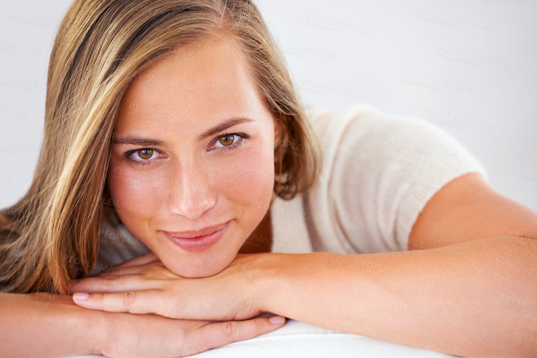 Buy stock photo Woman, portrait and closeup with smile on sofa for weekend break, relax and free time in living room. Happiness, comfort and face of female person on couch for peace, calm and rest in apartment.