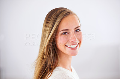 Buy stock photo Portrait of an attractive young woman giving you a bright smile